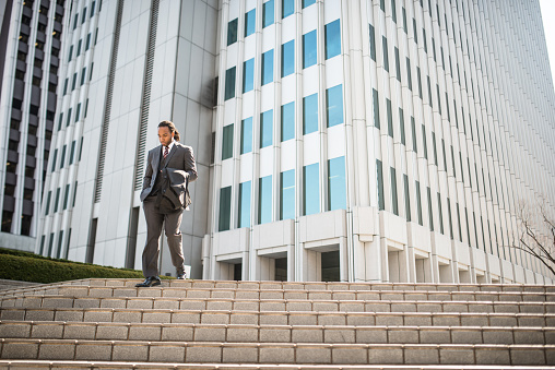 businessman descending steps