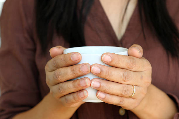 istock Hot coffee cup in woman hand. 480665827
