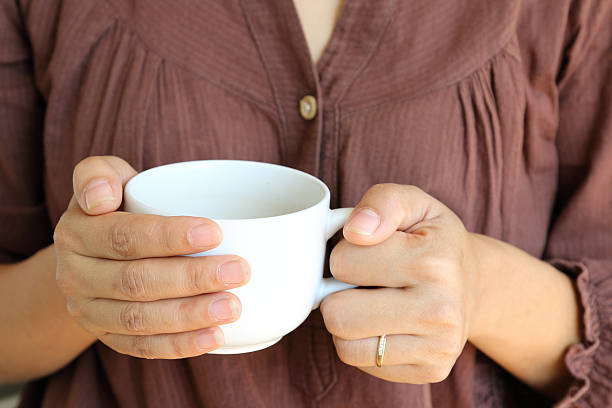istock Hot coffee cup in woman hand. 480665887