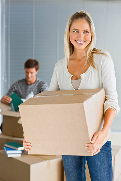 istock Young couple moving  house 480672161