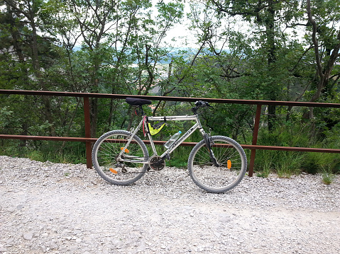 San Giuseppe della Chiusa, Trieste, Italy - May 25, 2015: Park your bike for a short break in the middle of the wood and enjoy nature