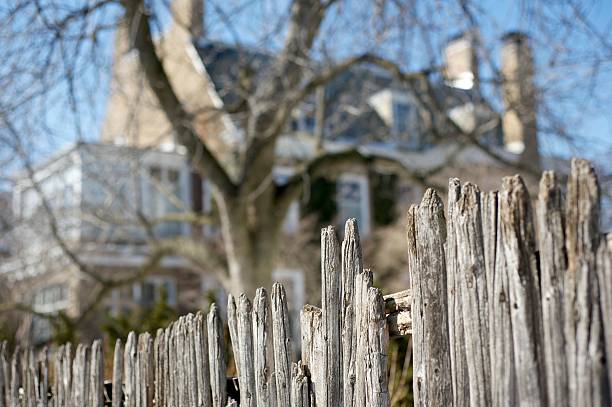 Wooden Fence with House stock photo