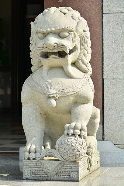 istock Grey stone lion statue outside the door 480681508