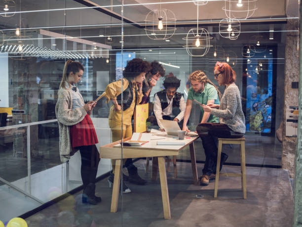 istock Multi-tasking group of creative people on a meeting. 480688480