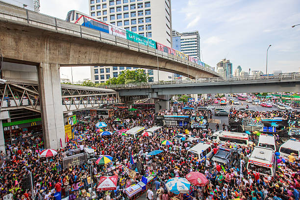 Songkran Festival Bangkok,Thailand-April 13,2014:Songkran Festival at Silom Road, Bangkok, is another beat place to celebrate Thai tradition New Year for thais and foreigners on Silom silom stock pictures, royalty-free photos & images
