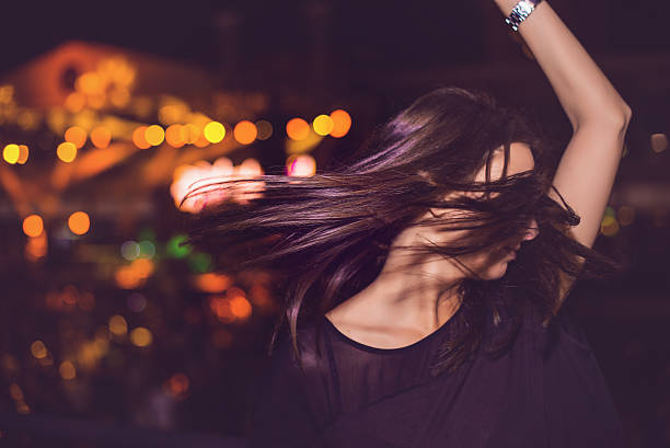 istock Girl dancing at concert 480689254