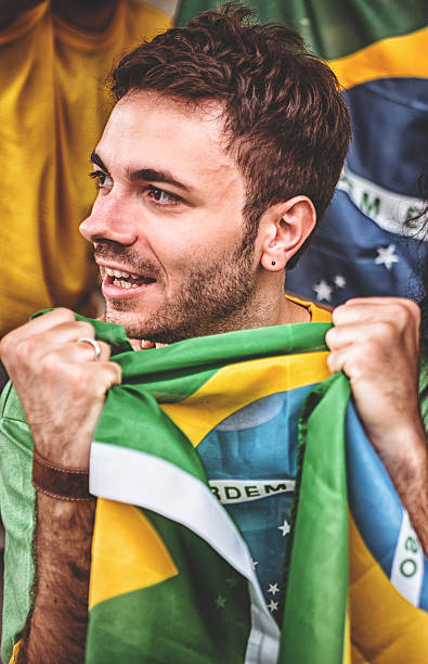 istock Brazilian supporter with brazil flag 480694089