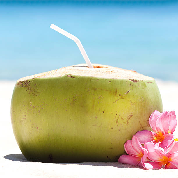 istock Tropical fresh cocktail on white beach 480694303