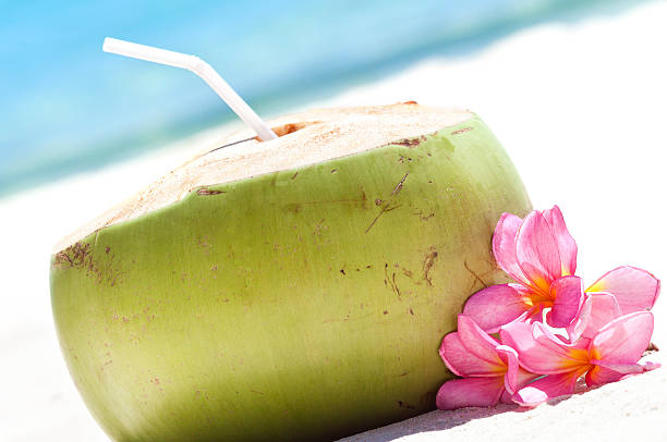 istock Tropical fresh cocktail on white beach 480694315