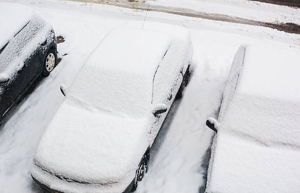 istock top view of car cover after snowfall. snow surface 480694328