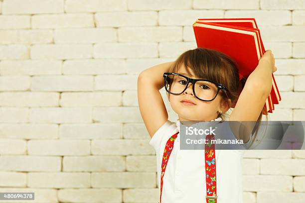 Preschooler Girl With Books Stock Photo - Download Image Now - Back to School, Child, Intelligence