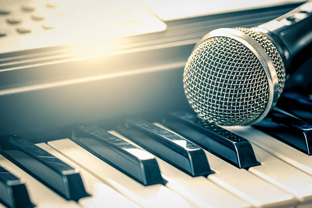 classical microphone on keyboard in vintage color tone
