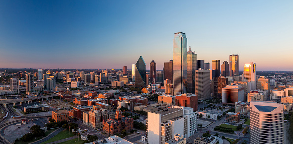 The unique buildings of downtown Houston, Texas shot at sunset on an early spring evening from an altitude of about 500 feet.