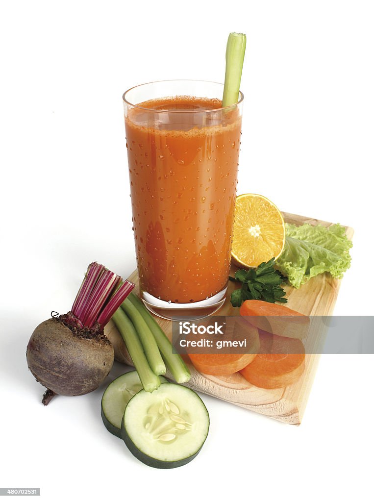 juice glass with carrot juice on white background Beet Stock Photo