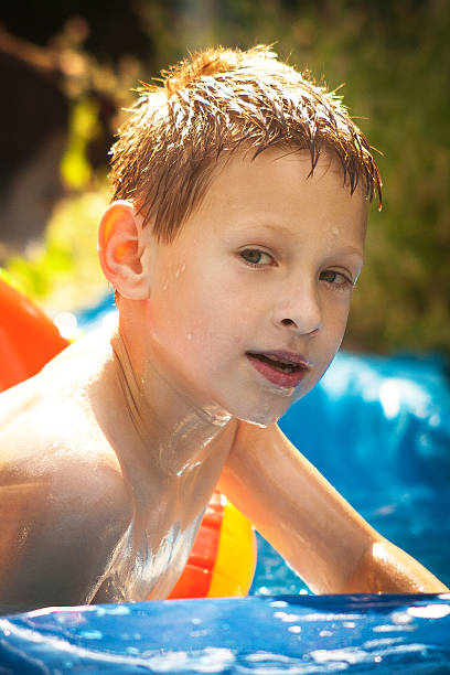 istock Happy little boy with an noodle float 480705766