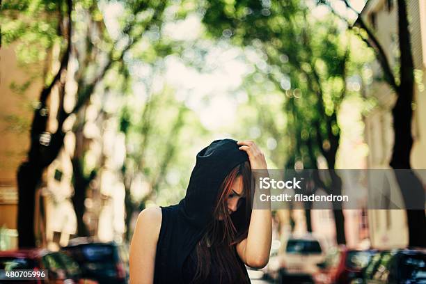 Sad Teenage Girl Walking On The Street Stock Photo - Download Image Now - Walking, Emotional Stress, Guilt