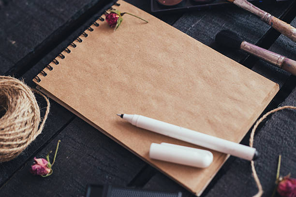istock Blank paper mockup with artist brushes on wooden table 480706000