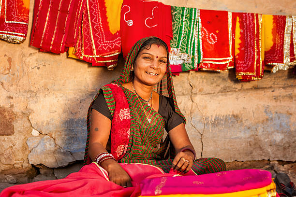 istock Indian woman selling colorful fabrics 480706170
