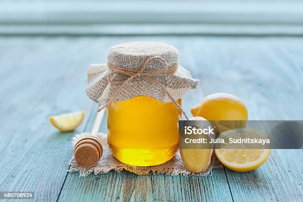 Honey In Jar With Twine Honey Dipper Lemon And Ginger Stock Photo - Download Image Now