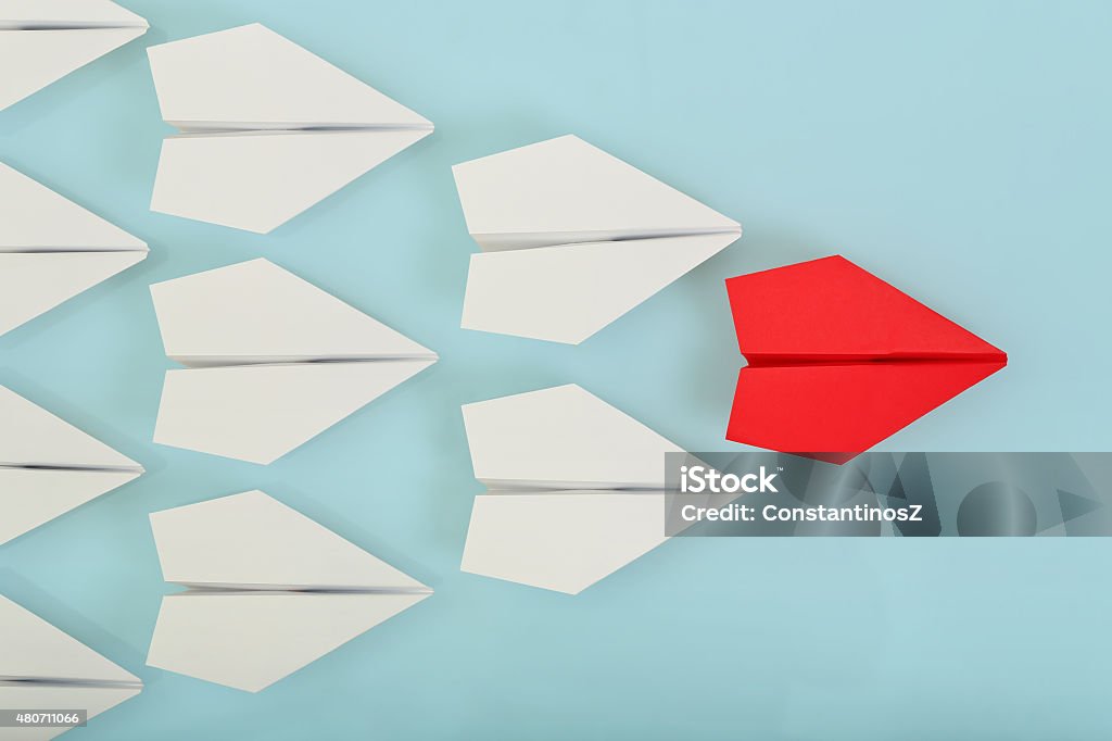 leadership red paper plane leading white ones, leadership concept Leading Stock Photo