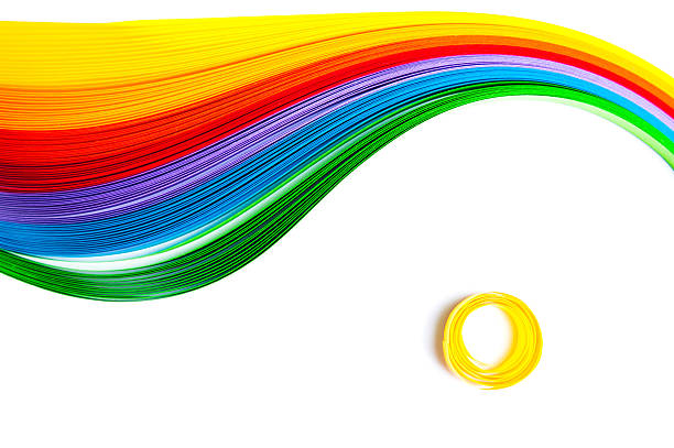 Rainbow colored quilling paper laid out in waves and shapes Rainbow colored quilling paper laid out in waves and shapes paper quilling stock pictures, royalty-free photos & images