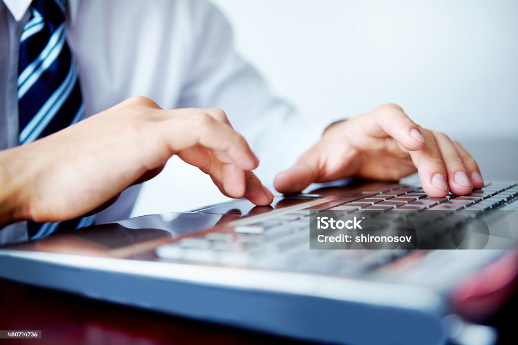 Laptop work Businessman typing on his laptop 2015 Stock Photo