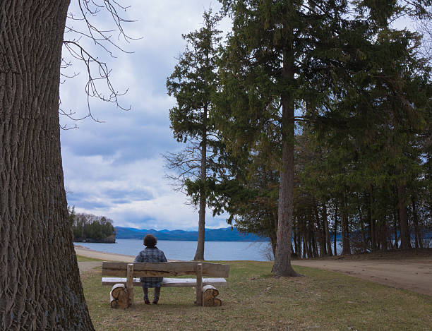 istock woman enjoying the lake view 480719864