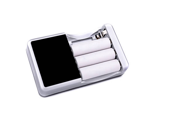 istock Battery charger with batteries on white background 480720364