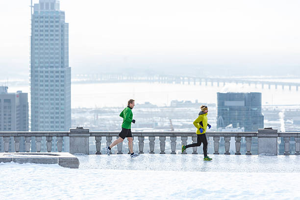 Trail runners training in the city stock photo