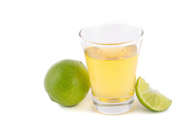 istock Gold tequila shot with lemon 480728755