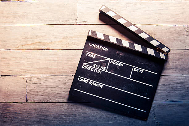 istock movie slate on a wooden background 480732819