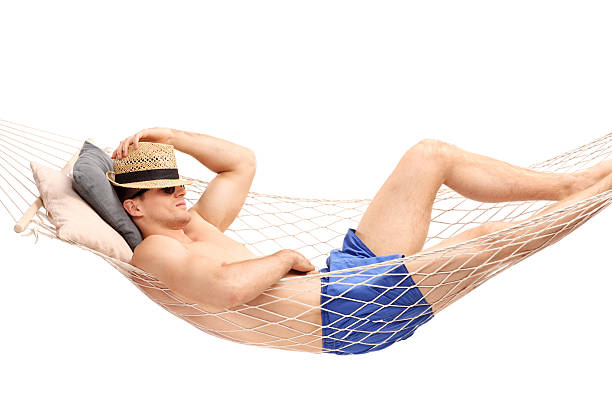 istock Guy in blue swim trunks sleeping in a hammock 480733004