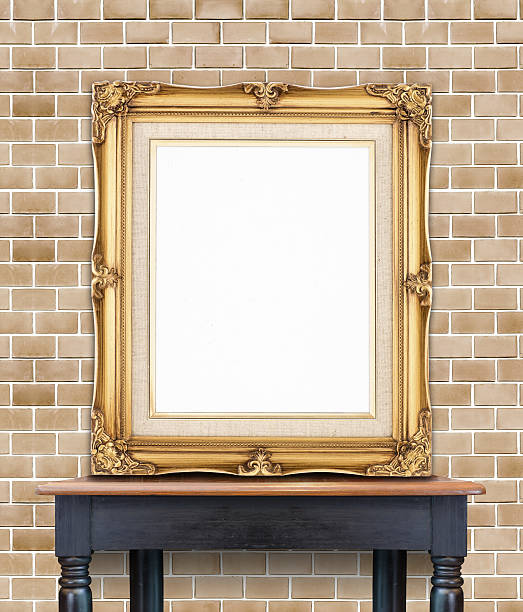 istock Blank vintage golden photo frame lean at brick wall 480733624