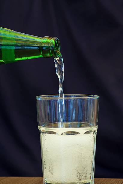 istock Young man pour mineral water 480736566