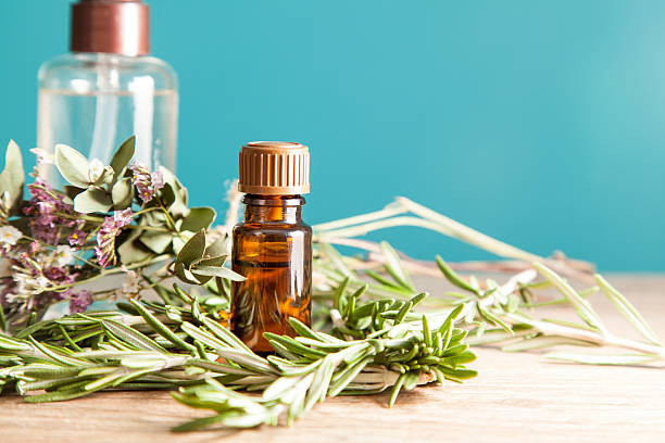 Bottle with aromatic oil and rosemary
