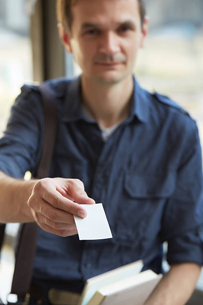 istock businessman giving a business card 480737994