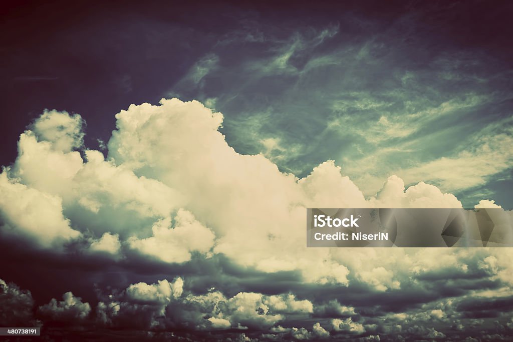 Sky with fluffy clouds. Retro, vintage style Sky with fluffy clouds. Retro, vintage style background Artist Stock Photo