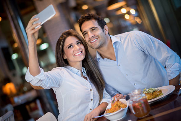 istock Couple taking a selfie at a restaurant 480738658