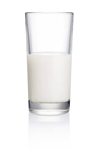 istock Half Glass of fresh milk isolated on white background 480740437