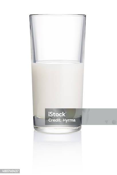 Half Glass Of Fresh Milk Isolated On White Background Stock Photo - Download Image Now