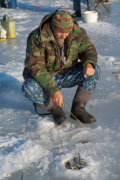 istock Man on winter fishing 480740869