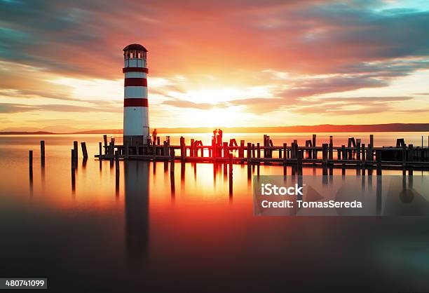 Beach Sunrise With Lighthouse Stock Photo - Download Image Now - Neusiedlersee, Summer, Atlantic Ocean