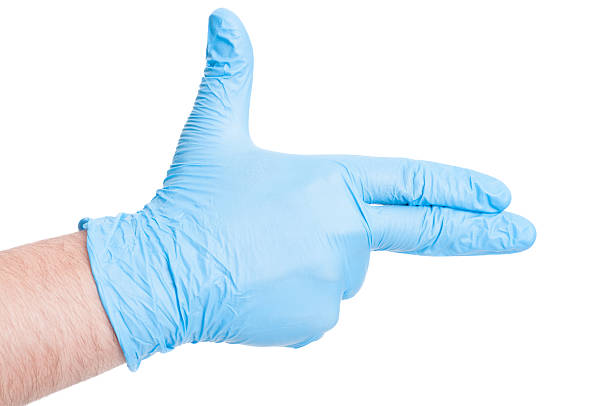 istock Doctor hand with latex glove making gun gesture 480742496