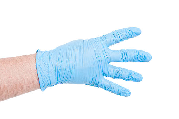 istock Doctor hand with glove showing number four 480742512
