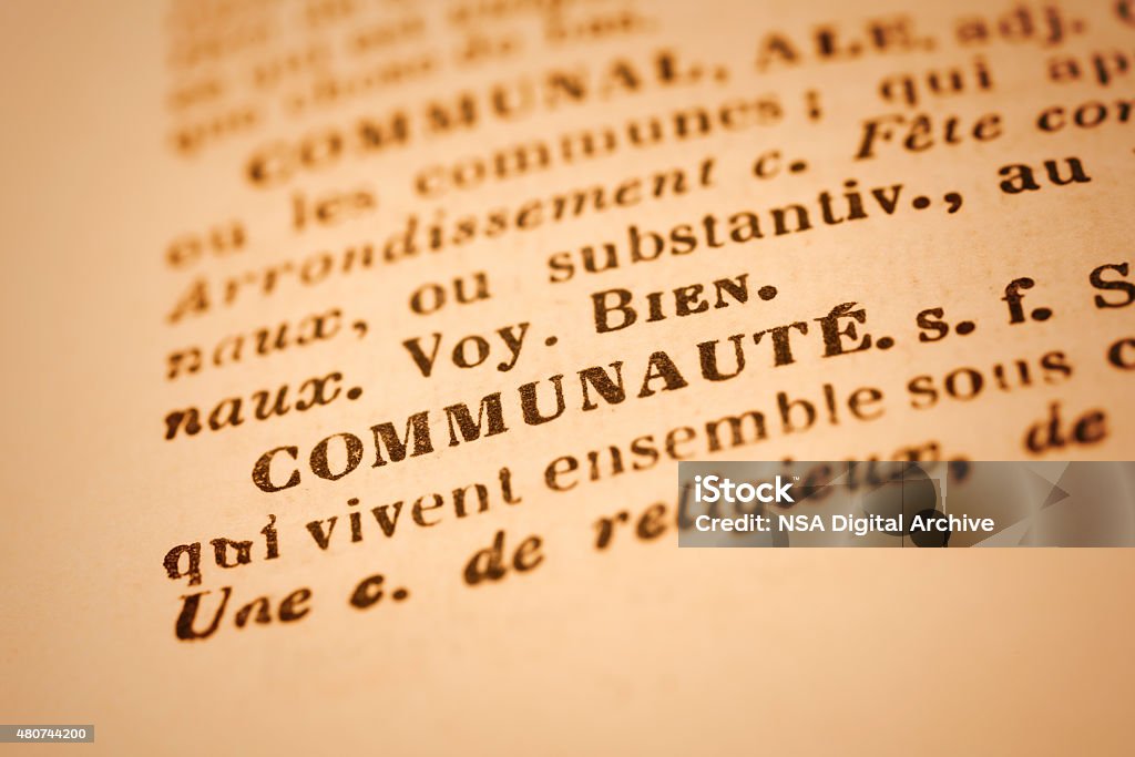 Communaute: French Dictionary Close-up Close up of the word COMMUNAUTE in an old French dictionary. Selective focus and Canon EOS 5D Mark II with MP-E 65mm macro lens. 2015 Stock Photo