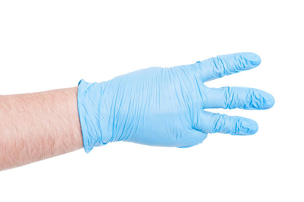 istock Doctor hand with glove showing number three 480744582