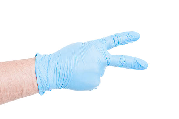 istock Doctor hand with glove showing number two 480744586