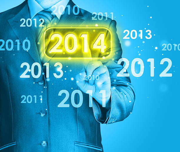 istock Businessman touching new year 2014 480749785