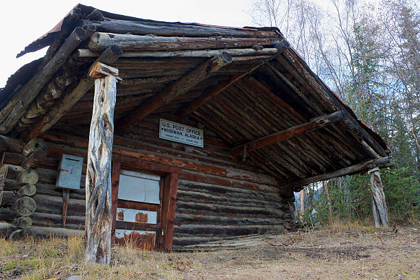 Old closed wooden post office cabin in Wiseman, Alaska