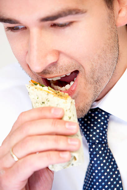 istock Businessman Eating a Wrap 480750755